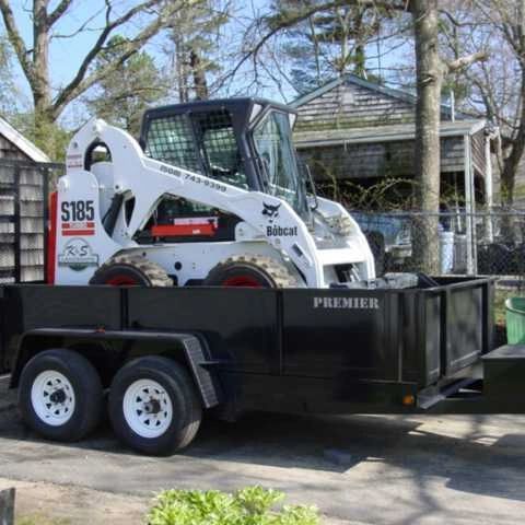 Bobcat skid-steer loader on trailer